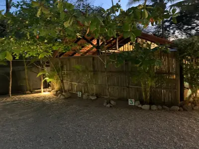 a group of stuffed animals sitting next to a fence at Casa Tropical Playa Grande in Cuajiniquil