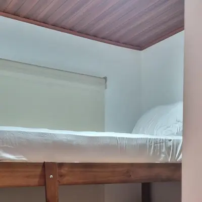 a bunk bed in a room with a ceiling at La Torre Azul in Alajuela City