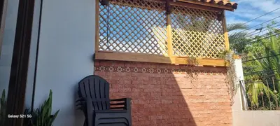 a black chair sitting in front of a balcony at La Torre Azul in Alajuela City