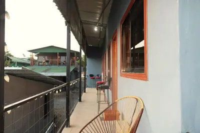 a balcony of a building with a chair on it at Siary Aparment con vista 3 in Monteverde Costa Rica