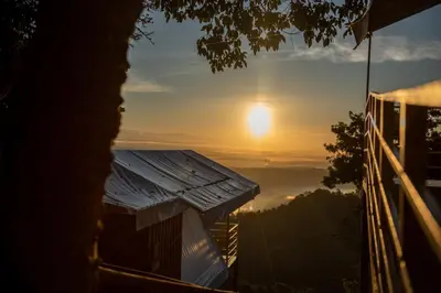 a view of the sunrise from a house at Quimera Glamping in Pacuar