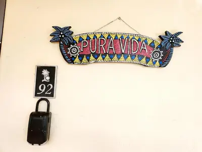 a sign that says purana vida hanging on a wall at Amazing Oceanview Private Villa Rooftop Terrace Walk to Beach in Coco