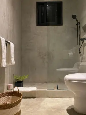 a bathroom with a shower and a toilet and a sink at CASA BÚHO in Santa Teresa Beach