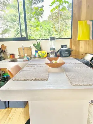 a kitchen table with a bowl on top of it at CASA BÚHO in Santa Teresa Beach