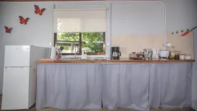 a kitchen with a counter top and a refrigerator at The frog house in Fortuna