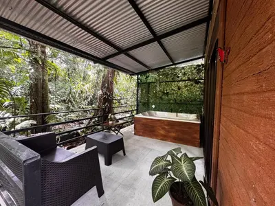 a bathroom with a bath tub on a balcony at The frog house in Fortuna