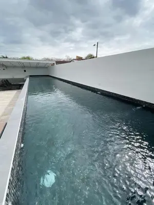 a pool of water next to a building at Vurá 201 in San José