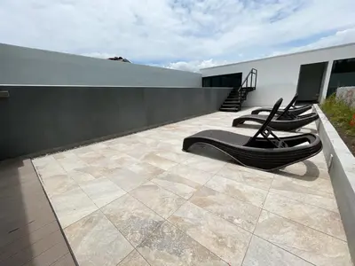 a patio with chairs on the roof of a house at Vurá 201 in San José