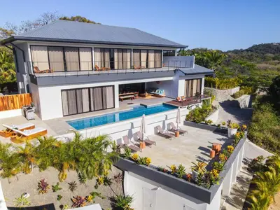 an aerial view of a house with a swimming pool at Casa Ojos Azules, Nosara. New Listing in Nosara