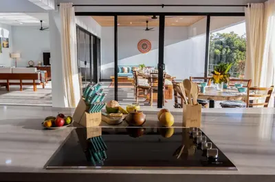 a living room with a table with fruits on it at Casa Ojos Azules, Nosara. New Listing in Nosara