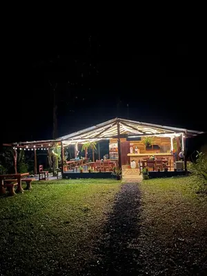 a building with lights on it at night at Pozas y Cascadas La Presa Habitación 1 in Río Cuarto