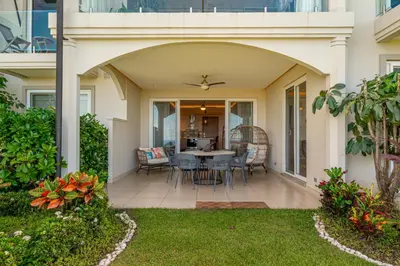 a patio with a table and chairs on a house at La Vista 2 - Diriá Tamarindo in Tamarindo