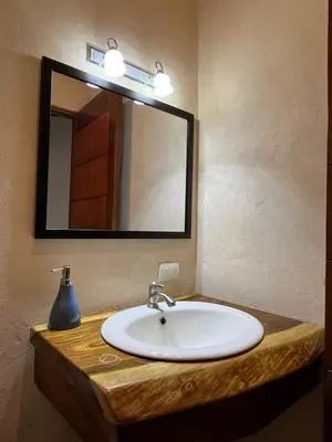 a bathroom with a sink and a mirror at Apartamento Entero El Guanacaste con Piscina Compartida in Santa Cruz