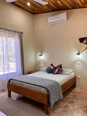 a bedroom with a bed and a window at Apartamento Entero El Guanacaste con Piscina Compartida in Santa Cruz
