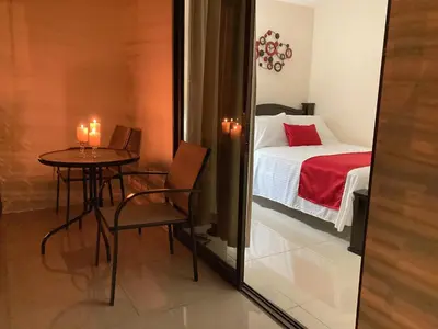 a small room with a small table and a bed at Hospedaje Ana Lu 2, Only 10 minutes from airport in Alajuela City