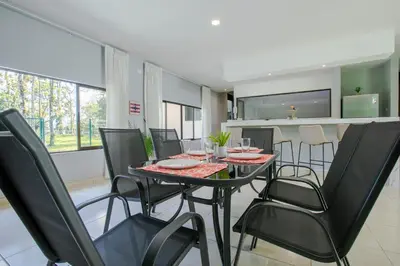 a dining room with a table and chairs at River Paradise Villa With Private Jacuzzi in Fortuna