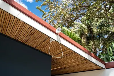 a window on the roof of a house at Modern 4BR Home, Pool, Parking, Walk To The Beach in Playa Flamingo