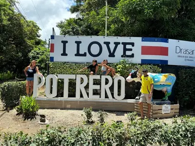 a sign that says i love portorero with people standing around it at Modern 4BR Home, Pool, Parking, Walk To The Beach in Playa Flamingo