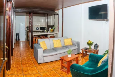 a living room with a couch and two chairs at Tony´s House #2 in Fortuna