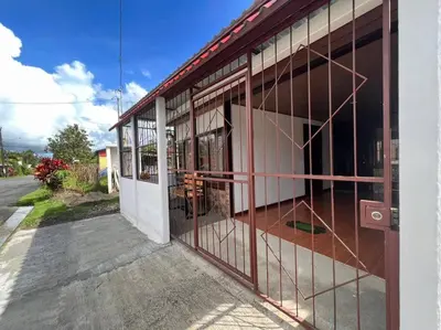 a building with glass doors on the side of a street at Tony´s House #2 in Fortuna