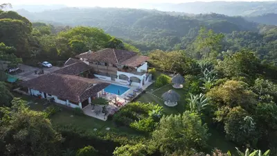an aerial view of a house in the forest at Hacienda Las Vainillas Boutique Hotel in Mastatal