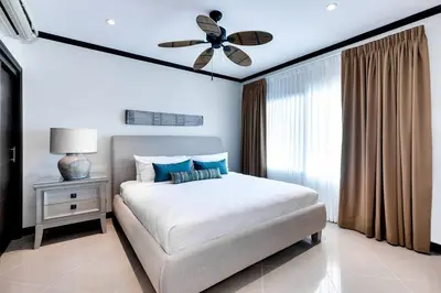 a bedroom with a bed and a ceiling fan at Diamante del Sol 202N - 2nd Floor Ocean View in Jacó