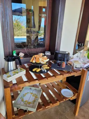 a wooden table with food on it in a kitchen at Villa Martina Palmgarden in Sámara