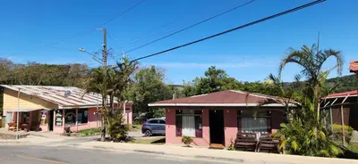 a row of houses on the side of a street at Twin Palms house in Monteverde Costa Rica