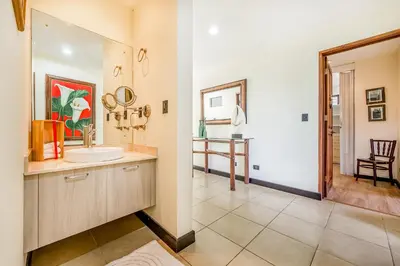 a bathroom with a sink and a mirror at Villa Casiopea in Carpintero