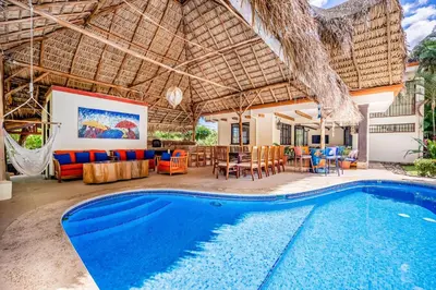 a villa with a swimming pool and a patio at Villa Casiopea in Carpintero