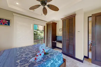a bedroom with a bed and a ceiling fan at Azul Paraíso 2B in Ocotal
