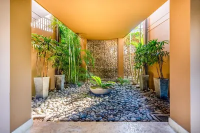 a garden in a hallway with rocks and plants at Azul Paraíso 2B in Ocotal