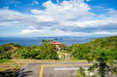 a parking lot with a view of the ocean at Azul Paraíso 2B in Ocotal