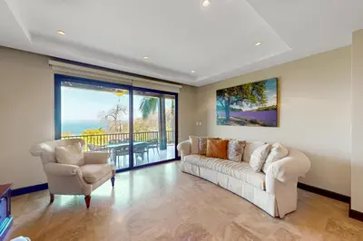 a living room with a couch and two chairs at Azul Paraíso 2B in Ocotal