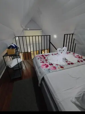 a bedroom with a bed with roses on it at Chalet La Fortuna YeyYe in Fortuna