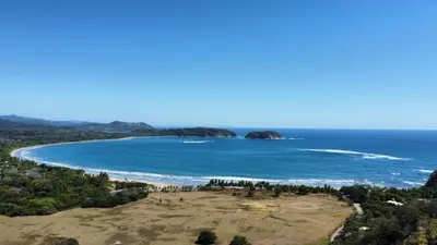 an aerial view of a beach and the ocean at Casa Terra Hostel in Sámara
