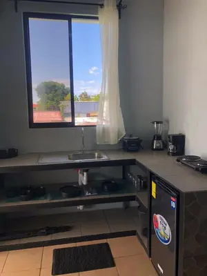 a kitchen with a sink and a window at Los Sueños IyE 4 in Quepos