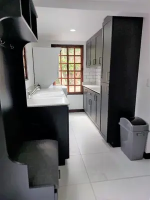 a kitchen with a sink and a toilet at Your Perfect Home Away From Home! in San Ramón