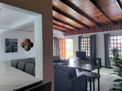 a living room with couches and a table at Your Perfect Home Away From Home! in San Ramón