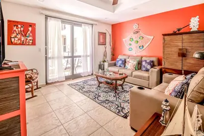 a living room with a couch and a table at Bahia Encantada I1 in Jacó