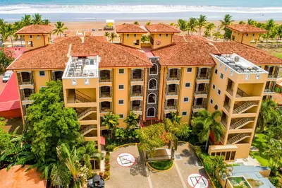 an aerial view of a resort with a beach at Bahia Encantada I1 in Jacó