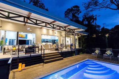a house with a swimming pool and a deck at Villa Ananda in Ballena