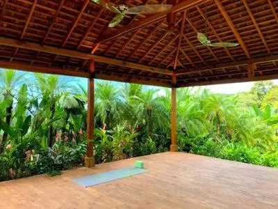 a large pavilion with a view of a forest at Villa Ananda in Ballena