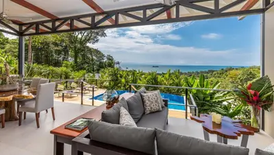 an open living room with a view of the ocean at Villa Ananda in Ballena