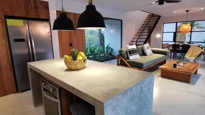 a kitchen with a counter with a bowl of bananas on it at La Golfina Villa in Santa Teresa Beach