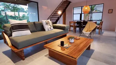 a living room with a couch and a coffee table at La Golfina Villa in Santa Teresa Beach