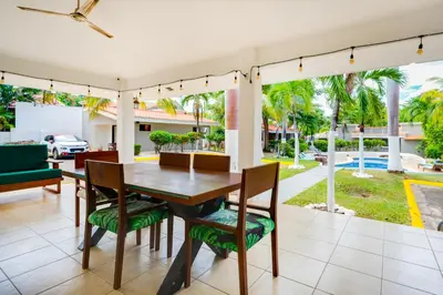a dining room with a table and chairs at Club Voca #9 in Coco