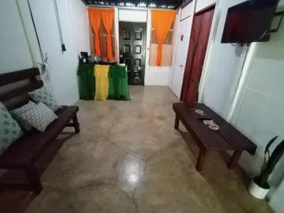 a living room with a couch and a table at Maricel House in San Rafael