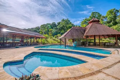 an image of a swimming pool with a gazebo at Toucan Valley Resort at Osa Mountain Village in Agua Buena