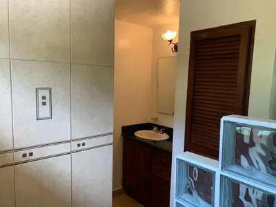 a bathroom with a sink and a shower at Toucan Valley Resort at Osa Mountain Village in Agua Buena